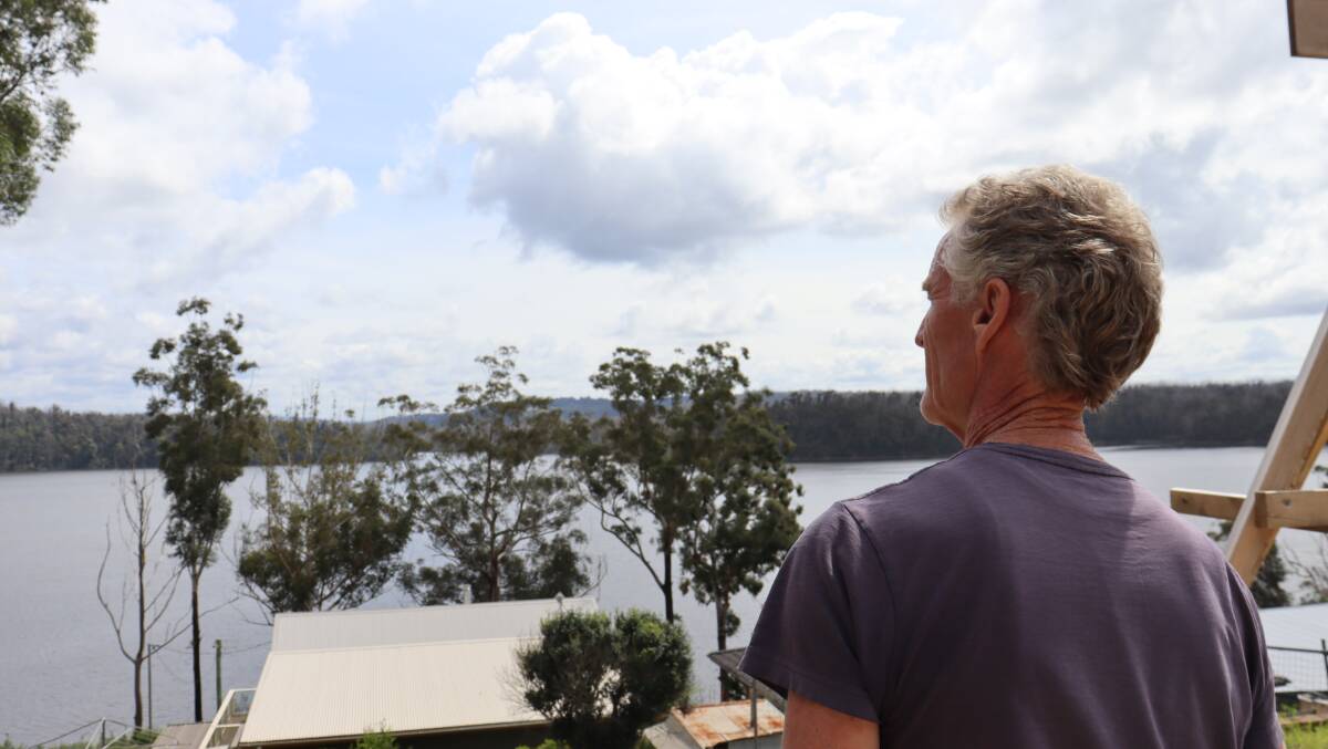 Greg Webb looking out over Lake Conjola from his property on the NSW south coast. Picture by Rosie Bensley