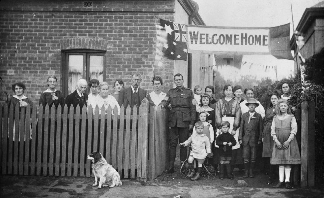 HOME FIRES: Sapper Arthur Findon Dunbar is welcomed home by his family at 45 Chief Street, Brompton, South Australia in July 1919. Picture: AWM P05328.001