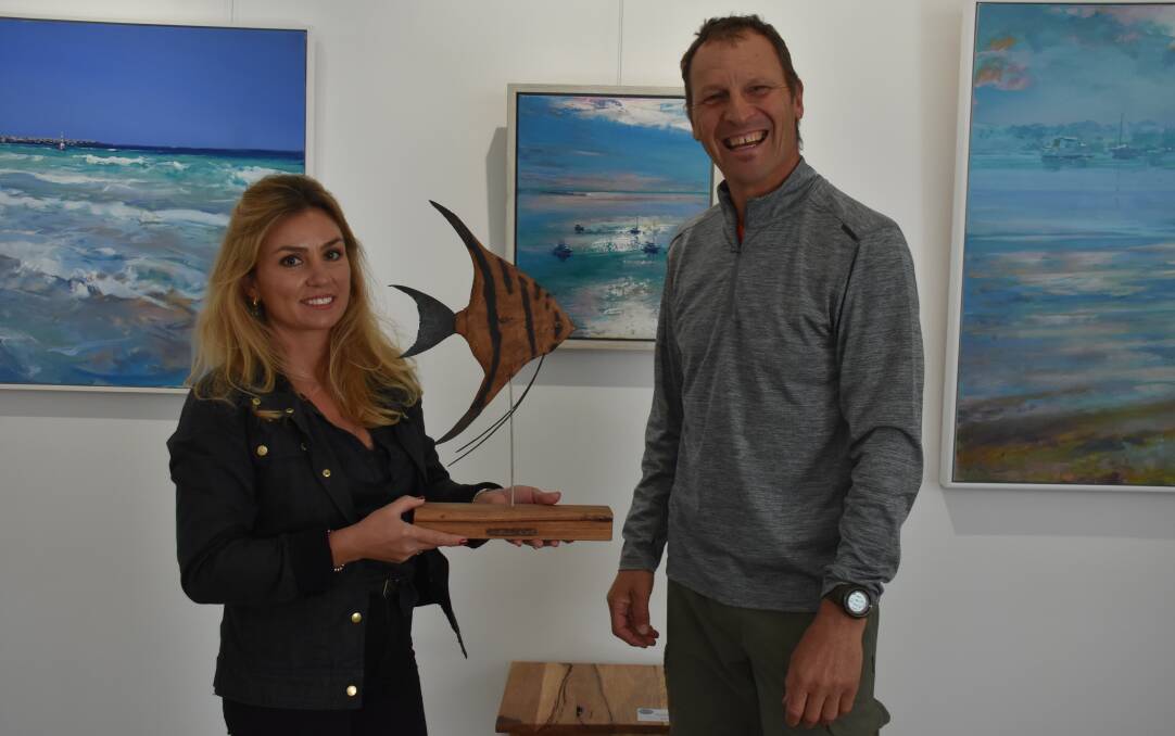 Bay Gallery manager Cerys Allerton and sculptor Alan Meyurgh with his angel fish available at Bay Gallery in Dunsborough.