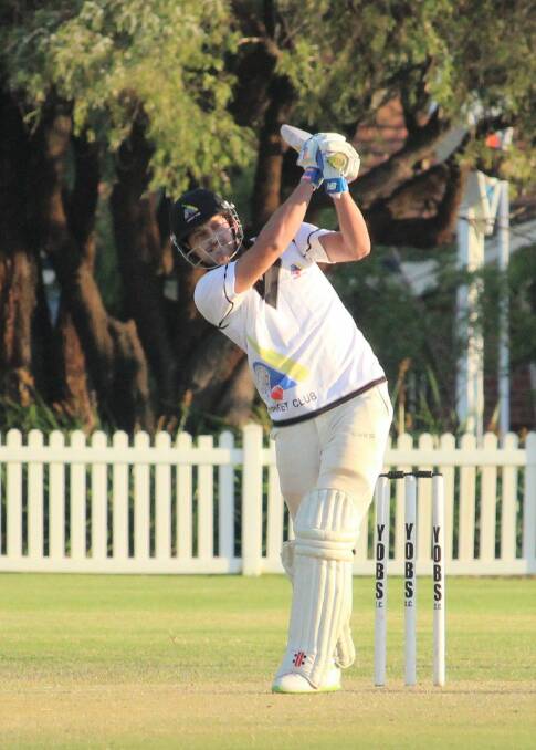 TAKE THAT: Allrounder Haig Colombera launches over deep midwicket for YOBS in the late stages of their game against St Marys at Barnard Park on Saturday. Photo: Vanessa Hatton.