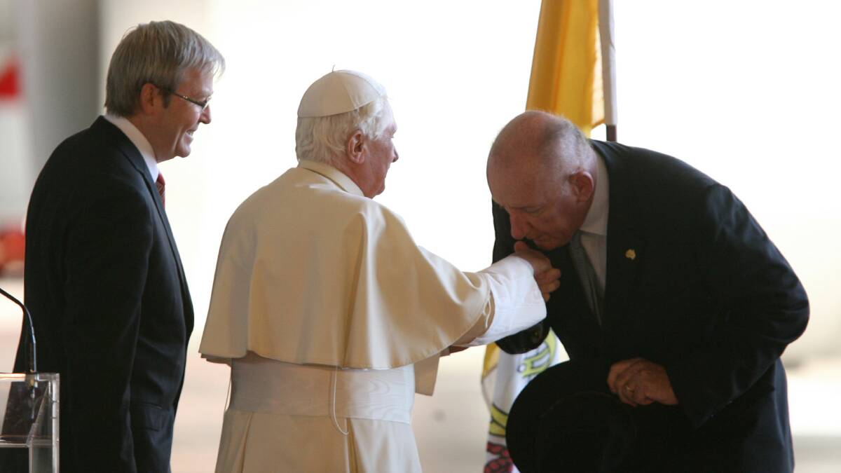 Faithful: Tim Fischer kisses the ring of Pope Benedict at Sydney airport after World Youth Day celebrations in 2008. Then prime minister Kevin Rudd watches on. 
