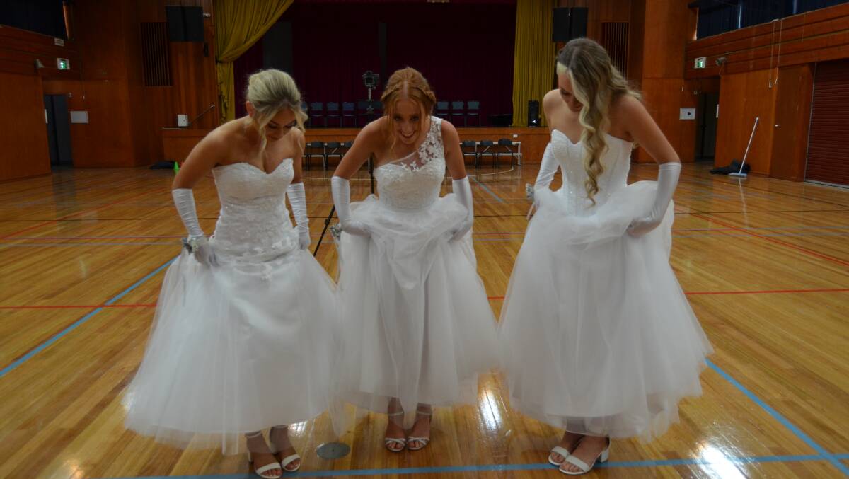 TO THE NINES: Holly Nuske, Hailey Puls and Ruby Hill are year 12 students ready for their debutante ball. Photo: Alison Foletta
