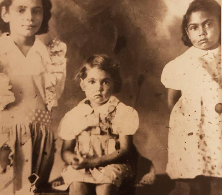 Juanita Kruger (far right) in 1943 with sisters Vera and Sally. The family was living in Katherine when the town was bombed in 1942. Picture: Supplied. 