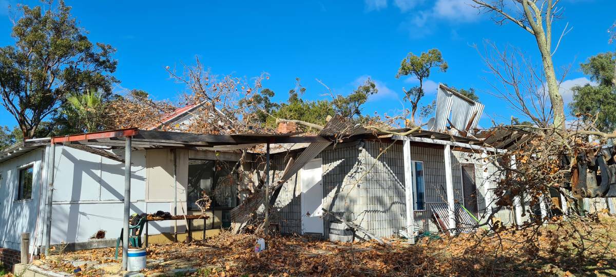 Destroyed: The Besall's rental property which has now been deemed unfit for habitation after a tree came down on their roof. Photo: Supplied.