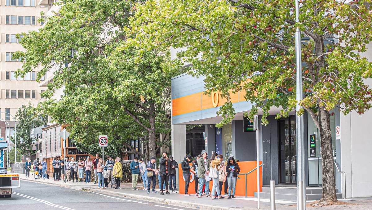 While there were queues outside Centrelink in March, Deloitte says Canberra has been largely shielded from job losses due to COVID-19. Picture: Karleen Minney