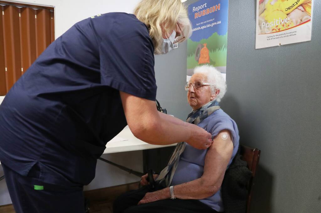 JAB: Jean Hutton gets her first dose of AstraZeneca with the help of registered nurse Jen Graves. Picture: Supplied/Nikki Davis-Jones 