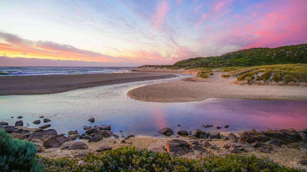 Serenity: The Margaret River mouth delivers another stunning sunset as the crowds descended on the South West region. Photo: Sean Blocksidge