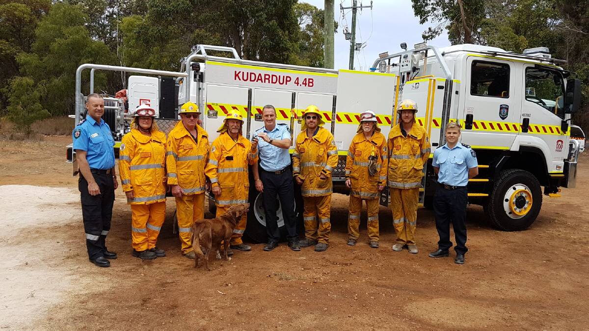 Shire Chief Bush Fire Control Officer David Holland (far left) and Shire Community Emergency Services Manager Chris Lloyd (far right) with Department of Fire and Emergency Services District Officer CAPES Danny Mosconi (centre) as he hands over the new truck keys to members of the Kudardup Bush Fire Brigade
