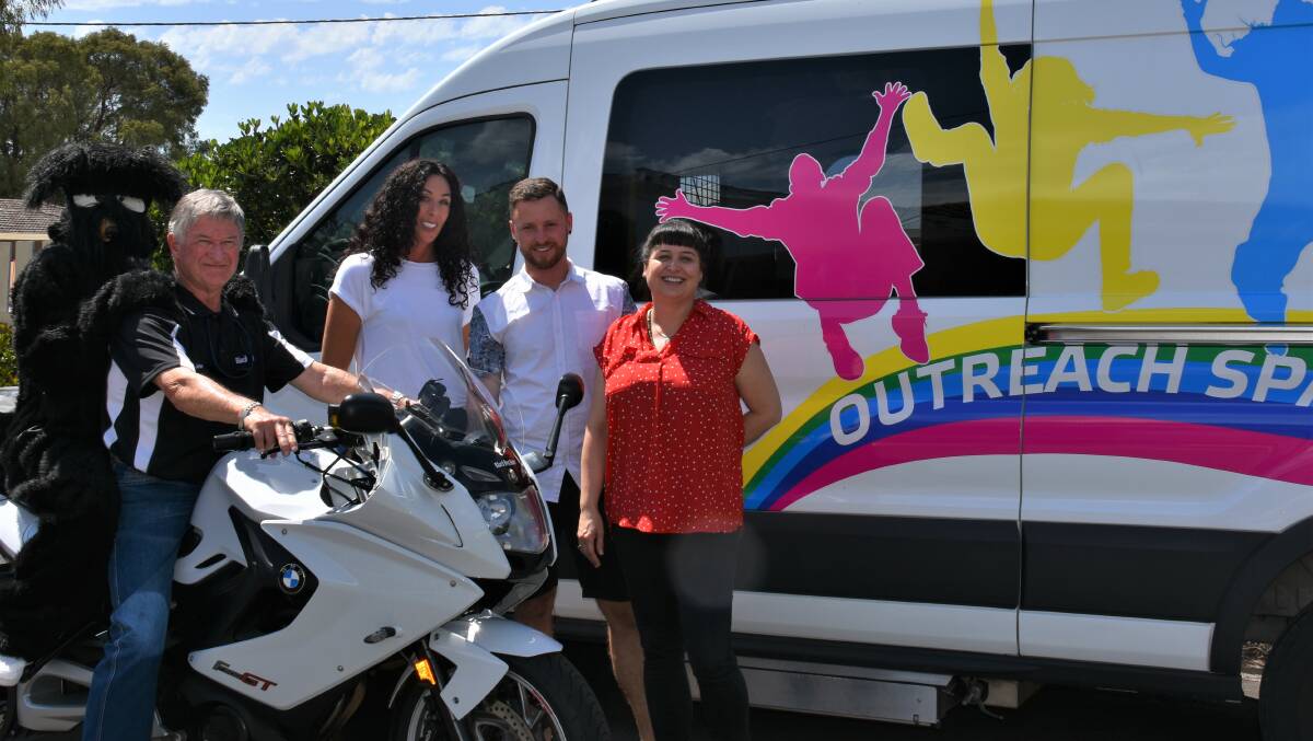 Black Dog Ride mascot and Lamp's youth Indigenous and family support officer Alex Eades with Black Dog Ride's John Lewin, Lamp's Jodie Fogliani, Jesse Malseed and Nicole Slevec.