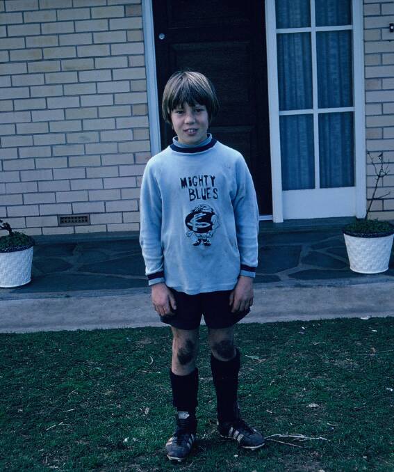 Sport was a constant for Barry growing up, he pictured with his football jumper.