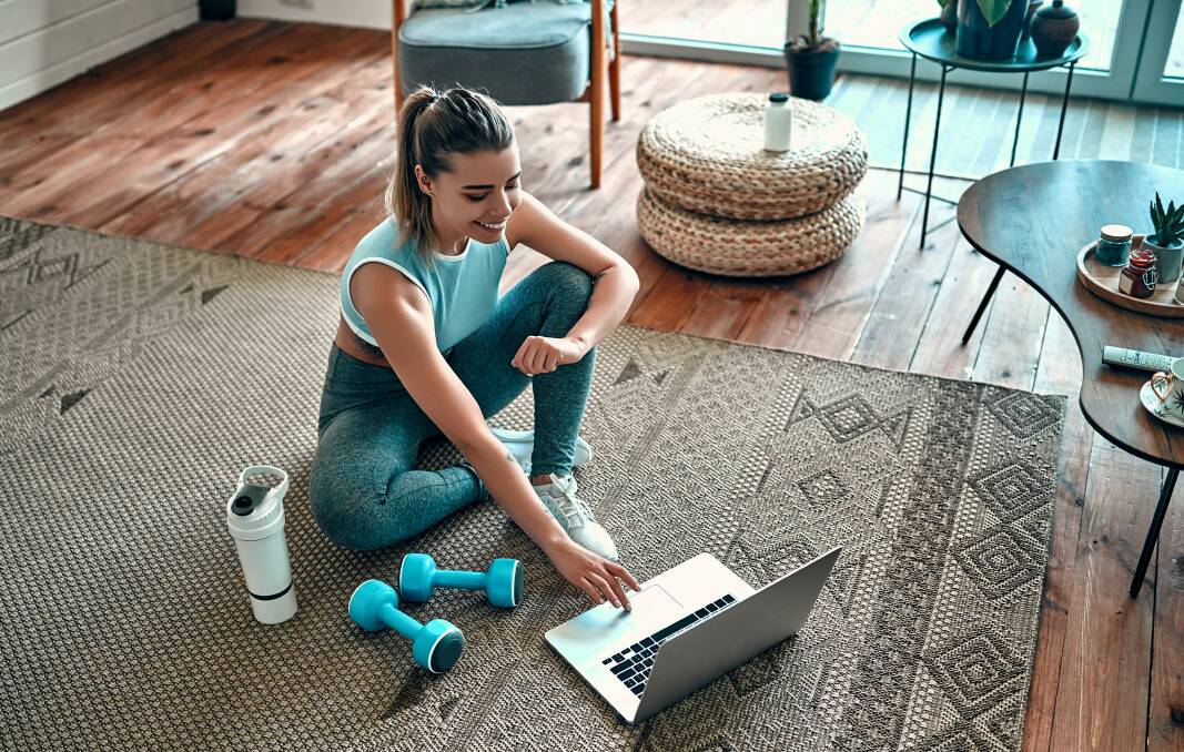 BETTER TOGETHER: Stronger online fitness communities were a happy by-product of exercising in iso - and experts predict we'll stay plugged in to these networks in 2022. Picture: Shutterstock.