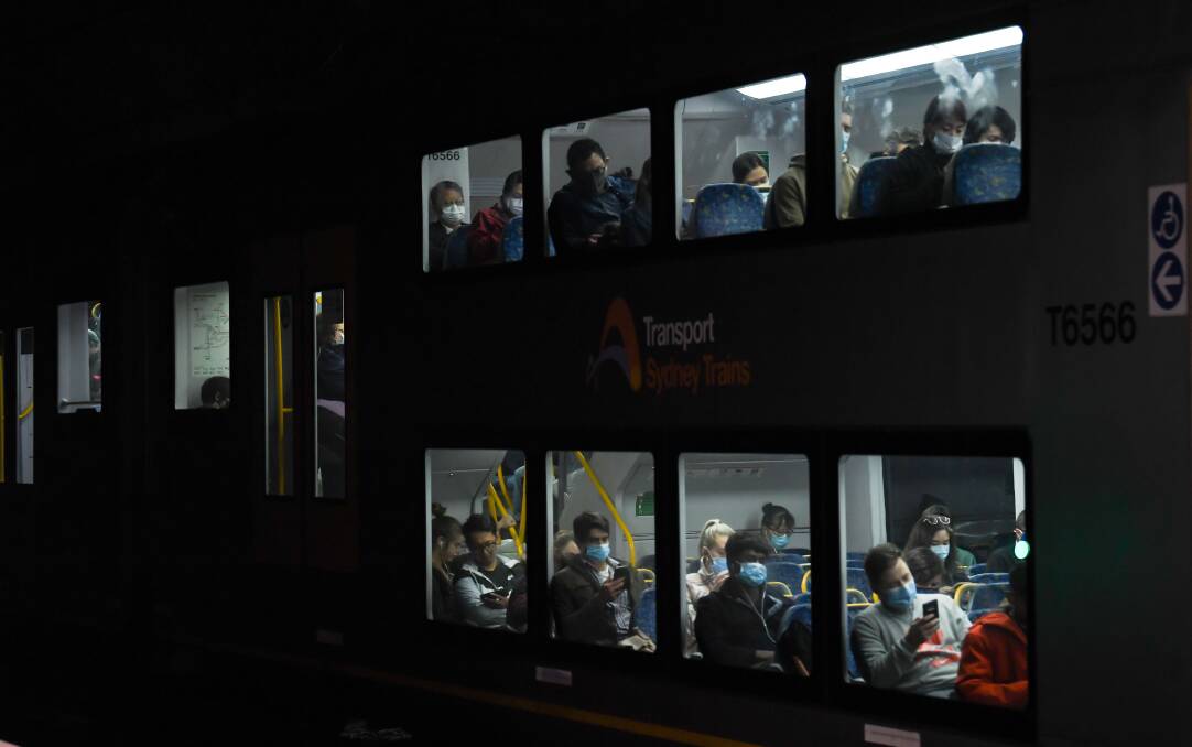 Passengers onboard a Sydney train. Most restrictions across Sydney will be extended for another week despite no new local cases of the virus. Picture: Getty Images