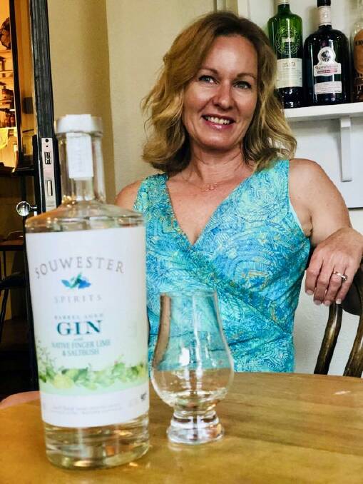 SouWest Spirits founder Danielle Costley with her barrel-aged gin. Image supplied.