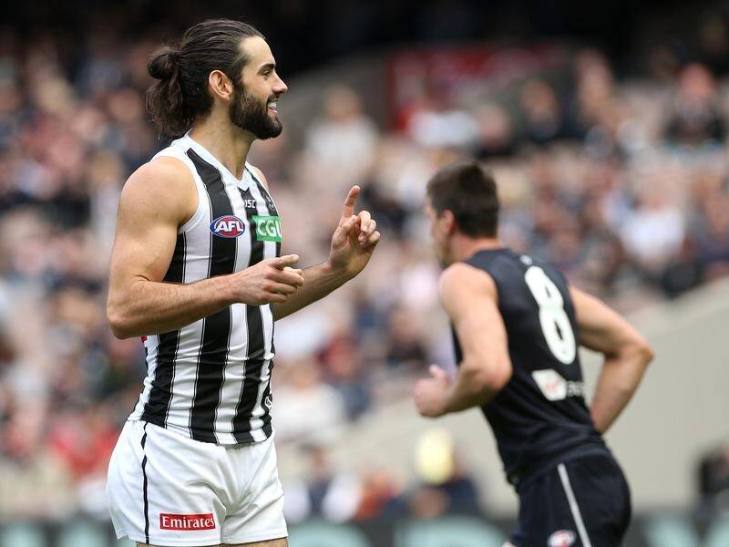 Brodie Grundy (left) has won Collingwood's best and fairest gong for his efforts throughout 2019.
