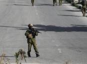 Israeli authorities say a soldier in Jerusalem apparently fatally shot an armed civilian by mistake. (AP PHOTO)
