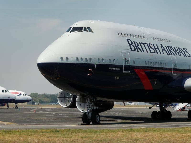 The owner of British Airways is mulling a legal challenge to the UK's 14-day quarantine rules.