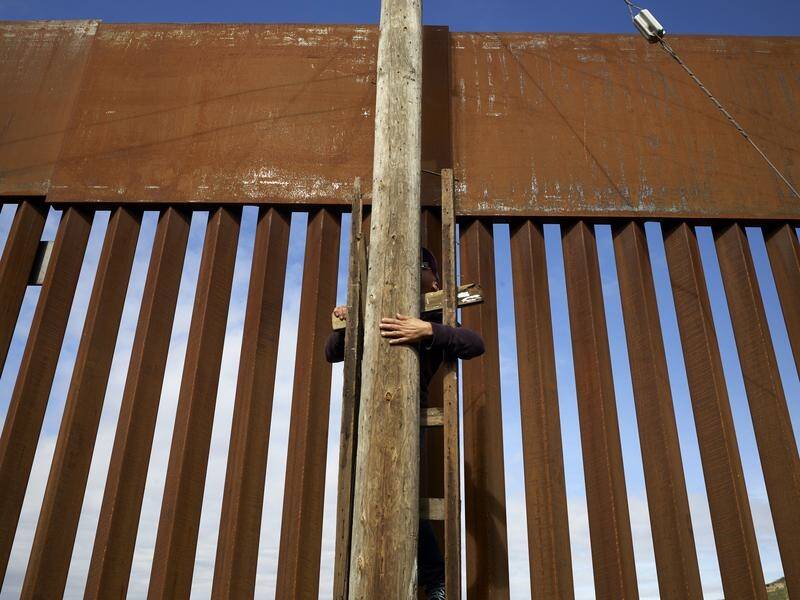 Senior US lawmakers are meeting to thrash out a plan to prevent another shutdown over a border wall.