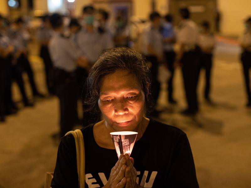 Hong Kong residents use candles to mark the Tiananmen Square massacre anniversary.