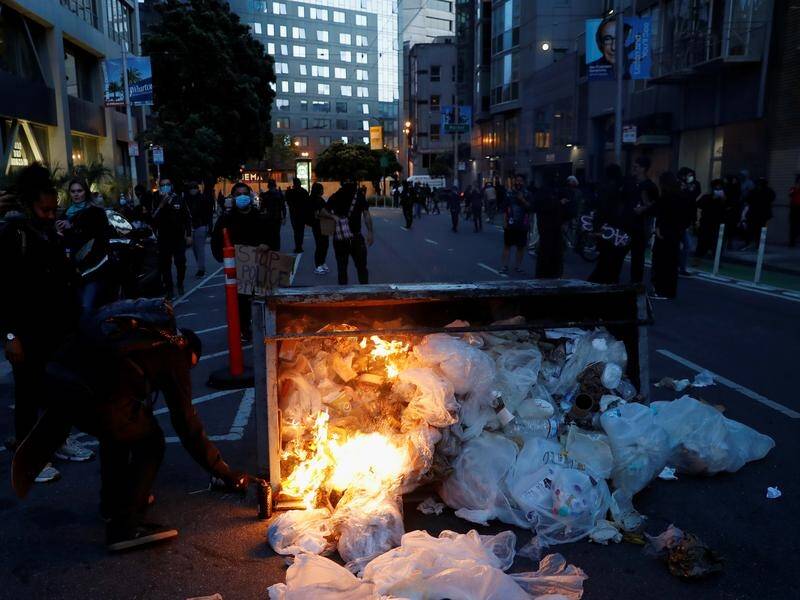 A suspected looter shot dead in San Francisco protests had a hammer, not a gun as police thought.