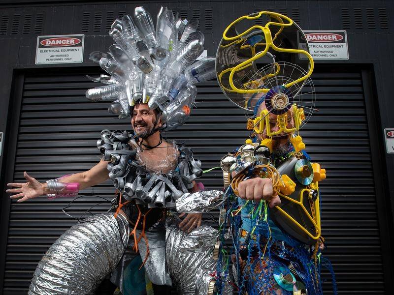 Nick Perrett (R) and Francisco Alcazar have made their costumes entirely from rubbish and recycling.