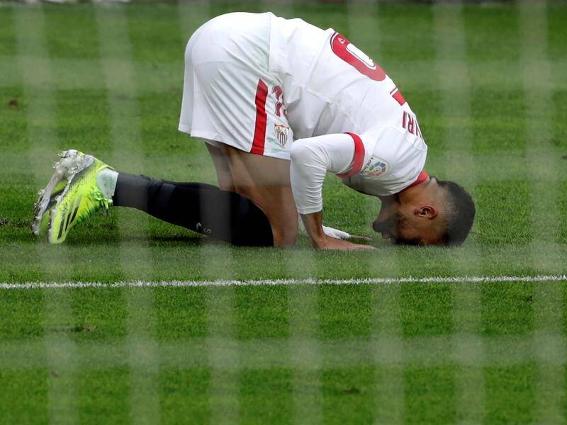 Sevilla's Youssef En-Nesyri celebrates his hat-trick goal against Cadiz in their 3-0 league win.