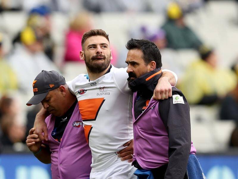 GWS star Stephen Coniglio will need scans after coming off in the Giants' big AFL loss to Richmond.