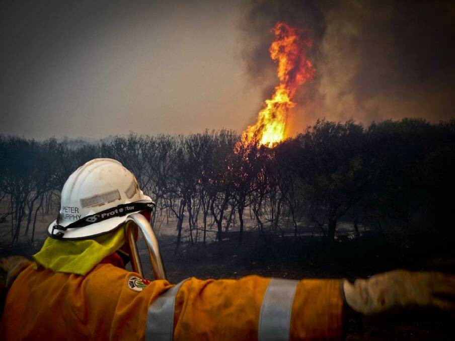 Firefighter Peter Murphy faces the Margaret River Bushfires in 2011. Pic: Sean Blocksidge 