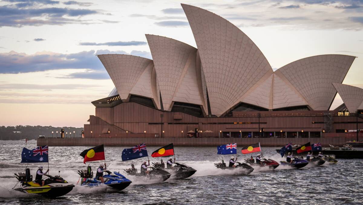 Jet skis with Australian and Aboriginal flags in front of the Sydney Opera House on Australia Day in 2021. Picture: Getty Images