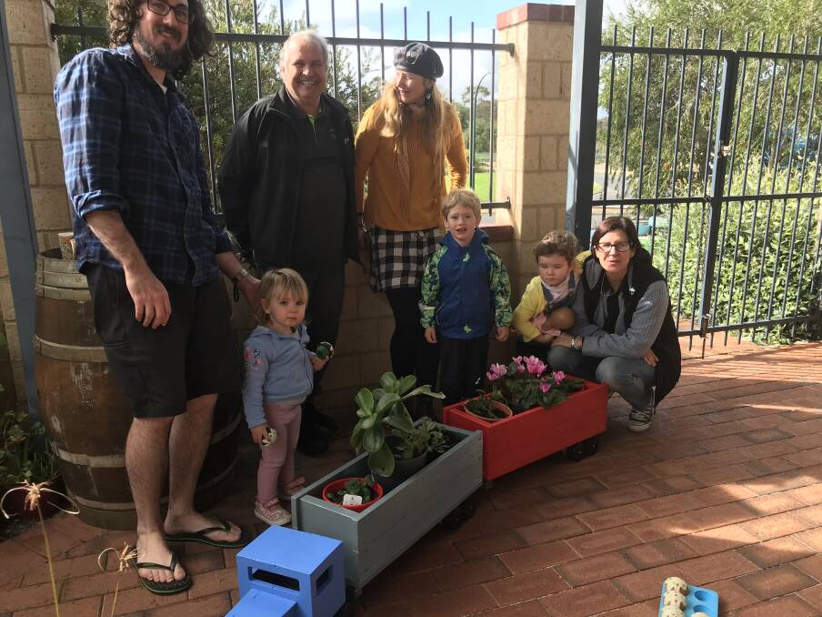 Local legend: Margaret River Men's Shed member Ross Mars stepped in to help restore some planter boxes for the Margaret River Intergenerational Playgroup.