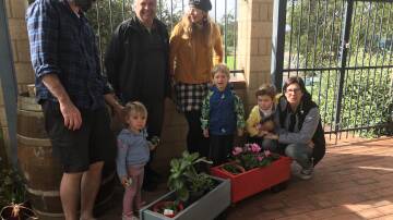 Local legend: Margaret River Men's Shed member Ross Mars stepped in to help restore some planter boxes for the Margaret River Intergenerational Playgroup.