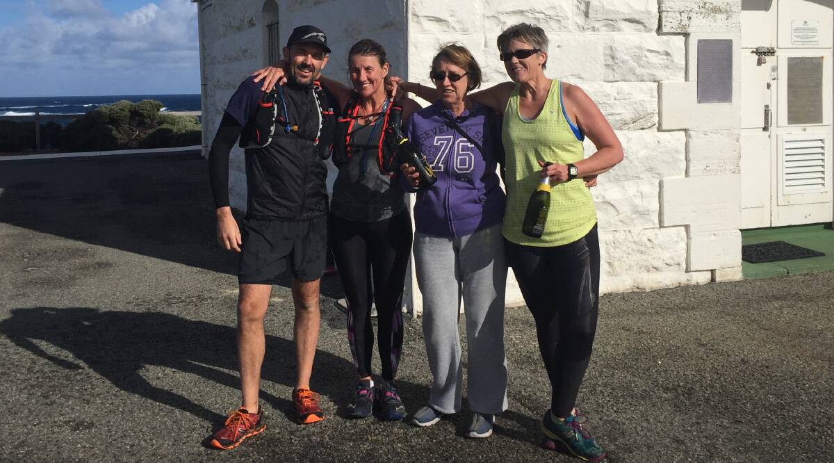 Weary smiles: Martin Tonna and Bec Hannan (left) with support team Sunny Michelle Hannan and Gillian Ramsay after their gruelling overnight run.