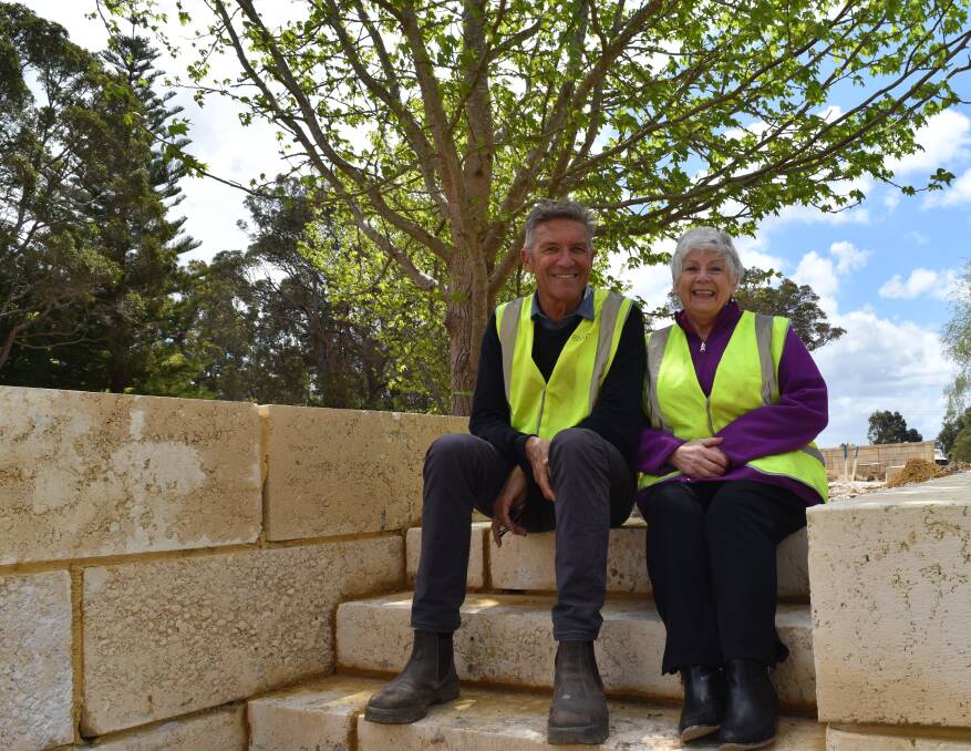 Adan Nicholson and Sandra Lewis take a minute to check out the site of Ms Lewis' brand new home. 