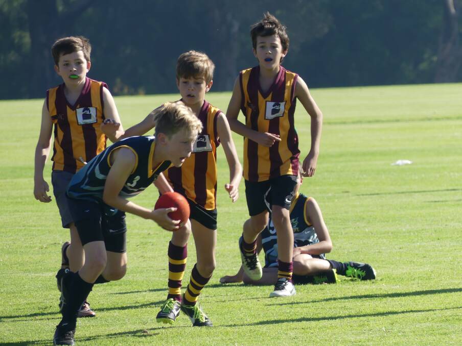 Great play: Action from the Bulls Red v Hawks Navy 11s clash at Cowaramup oval. Photo: Supplied