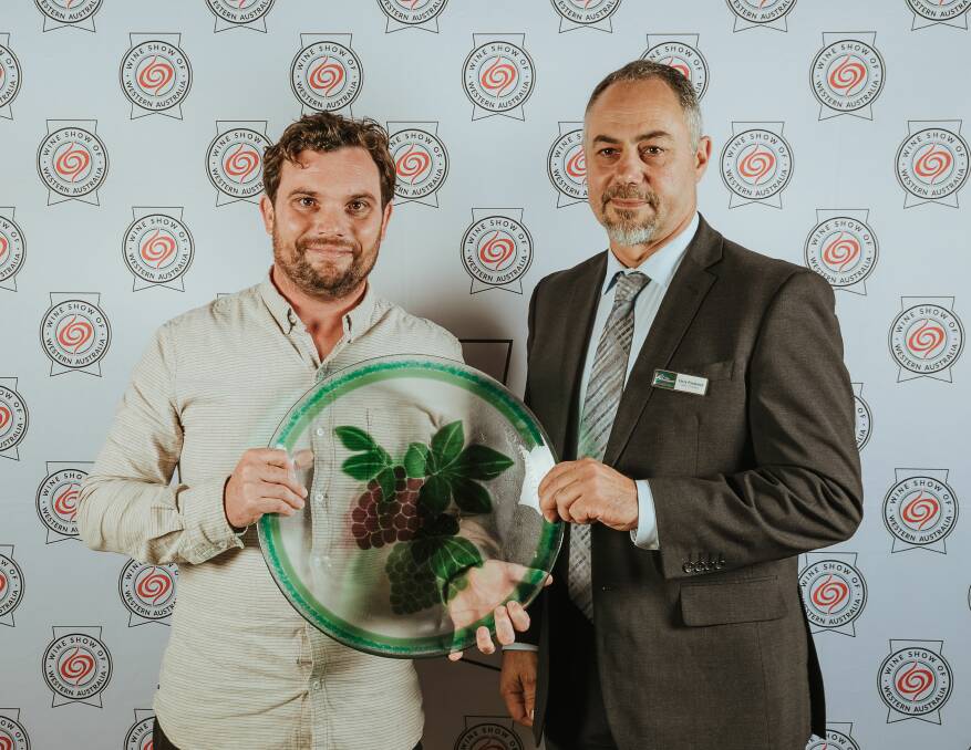 Xanadu winemaker Brendan Carr is presented with the trophy by Chris Pavlovich, Shire President, Shire of Plantagenet.
