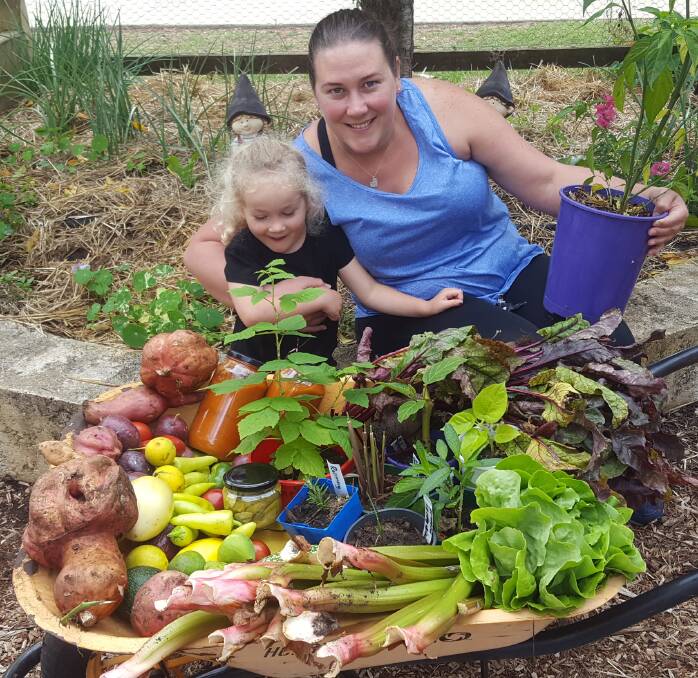 Winners of Margaret River Primary School’s Kitchen Garden Zucchini Competition Lauren Fraser with daughter Hope, about to take home a generous bounty of plants and produce, all sourced from the MRPS Kitchen Garden Program.