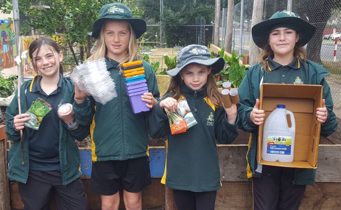 Year 4 students Billie-Violet Mahon, Tilly Donegan, Amelia Otto and
Poppy Passanisi with just a few of the community donated items currently reused, recycled or repurposed in the MRPS Kitchen Garden Program. Photos: Supplied