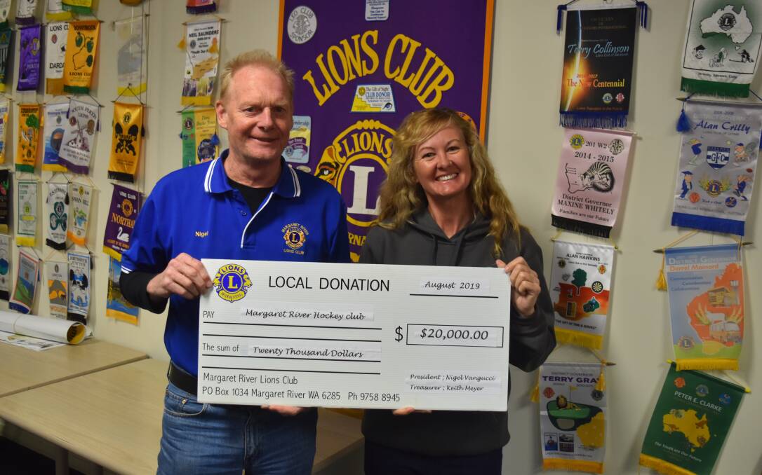 Nigel Vangucci presents a $20,000 donation from the Margaret River Lions Club to Maxine Williams from the Margaret River Hockey Club. Photo - Nicky Lefebvre