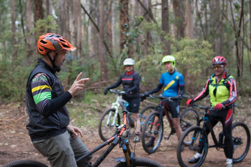 Expert advice: Stuart Burgess (left) is one of the instructors for Girls on Dirt Day. Photo: Jodie Berry