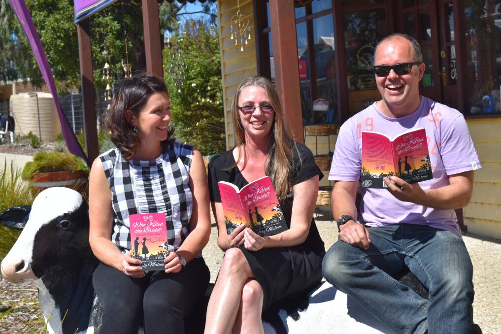 Team effort: Lily Malone (centre) with Mukau Gallery owners Wendy and Kerry Sibly and the new book, which will be on sale at the Cowaramup store. Photo: James Bunting.