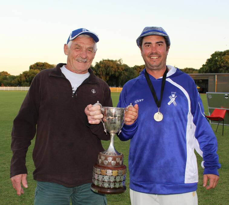 THEN AND NOW: Brian Earl, who captained St Marys to their previous A-Grade flag in 1984, holds the Barnard Cup with new premiership captain Danny Hatton.