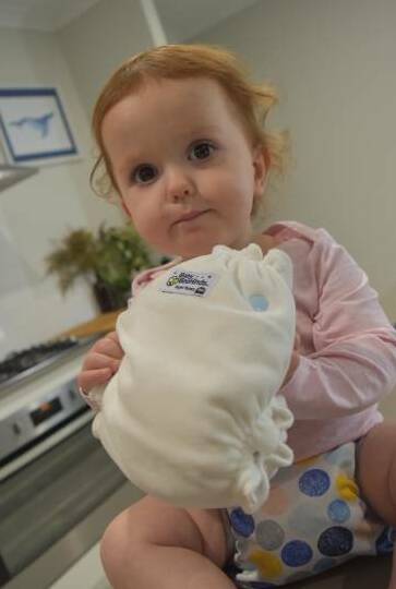 Baby Ivy Stephens tries out the latest cloth nappies. 