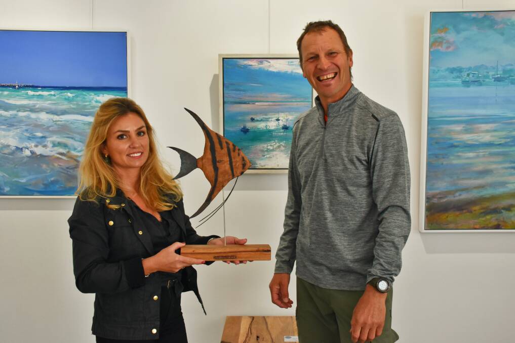 Bay Gallery manager Cerys Allerton and sculptor Alan Meyburgh with his angel fish available at Bay Gallery in Dunsborough.