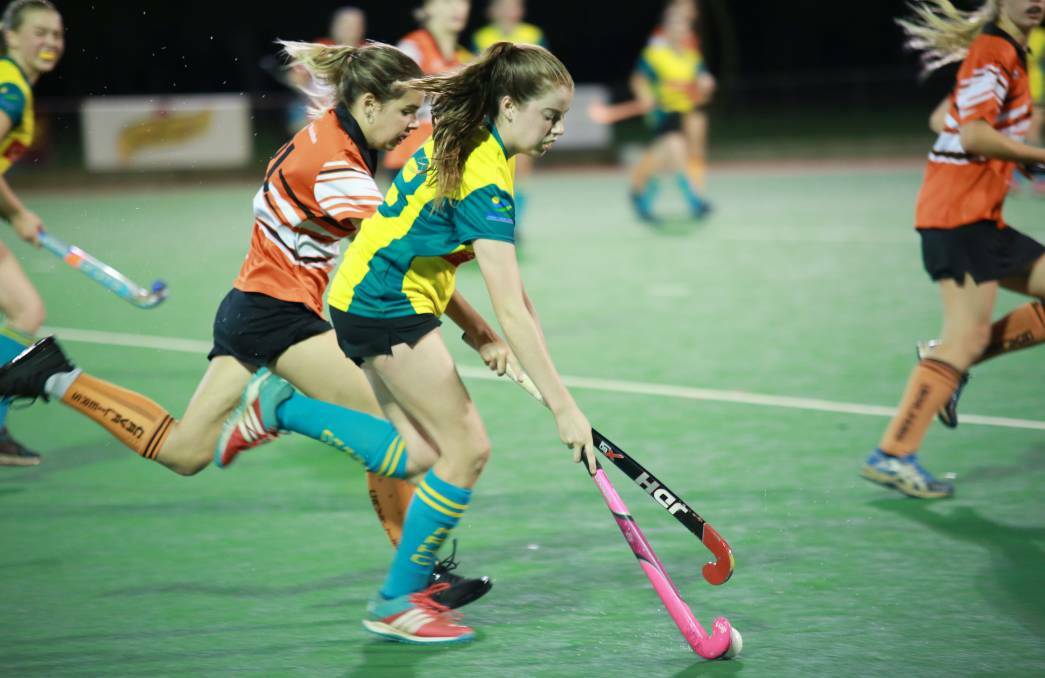 Determination: Young hockey star Ashlee Jarvis puts her skills to good use for Margaret River. Photo: Louise Mann