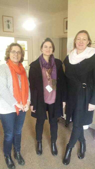 Stephanie Addison-Brown (right) chats with Kirsten Bosich and Katherine Royer from Naturaliste Community Health.