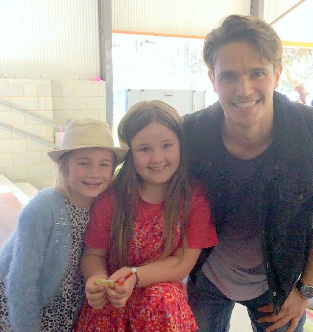 Margaret River Independent School students Olivia Appleton and Tallulah Horsey with tv star, Nic Westaway last week. 