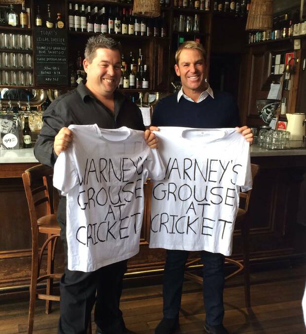 Legendary meeting: Michael Earl (left) with Shane Warne in 2014, during a visit to Melbourne 13 years after his infamous 'dummy spit' in the crowd at the WACA in Perth. Picture: Supplied