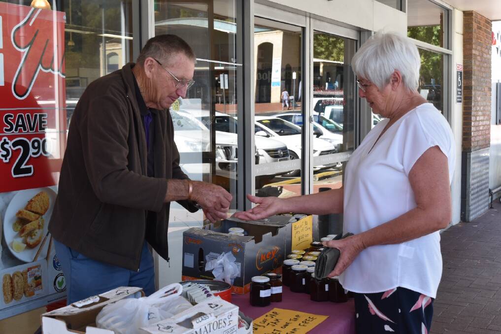 What a legacy: Bob Castle sells one of his final jars of jam outside Coles on Thursday. Photo: Nicky Lefebvre
