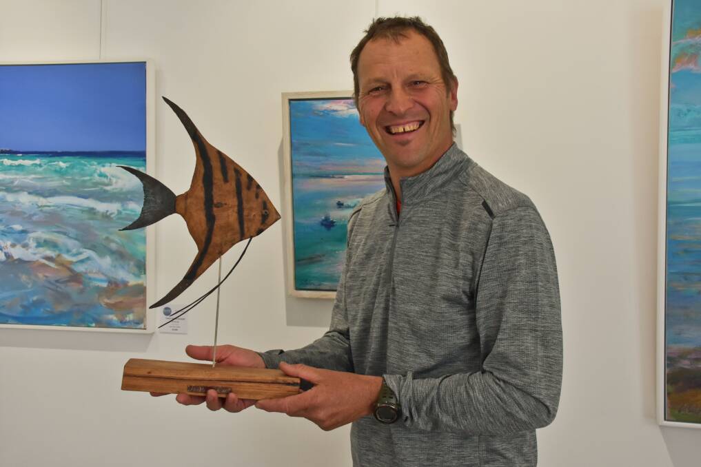 Sculptor Alan Meyburgh with his angel fish available at Bay Gallery in Dunsborough.