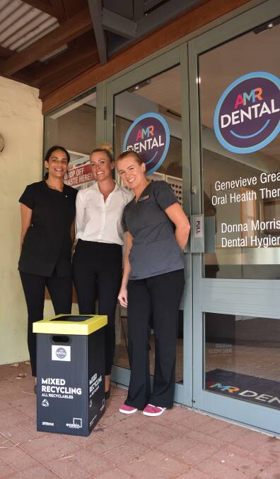 Jess, Donna and Genevieve at AMR Dental with the recycling bin where residents can drop their old and unused items like toothpaste tubes and toothbrushes. 