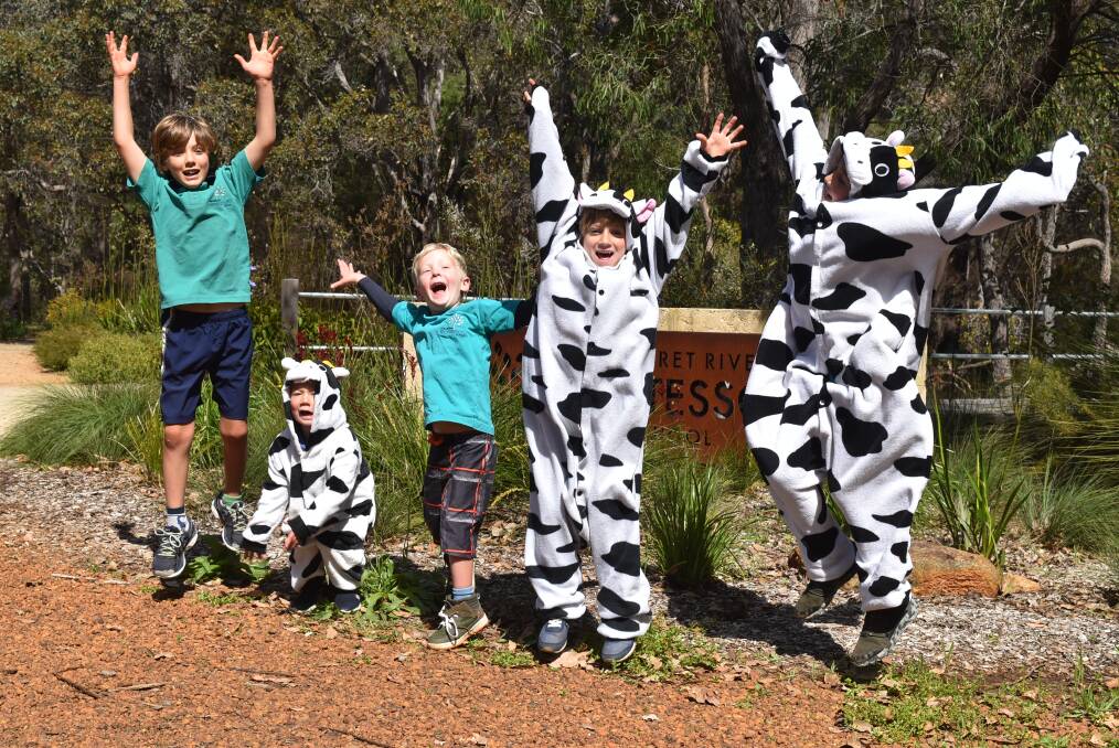 Jump for joy: Students from Margaret River Montessori School embrace the fun and excitement of the annual cow pat lotto. 